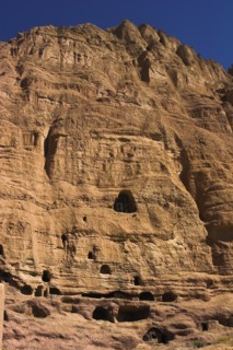 AFGHANISTAN, Bamiyan Province, Bamiyan , Caves in cliffs near empty niche where the famous carved