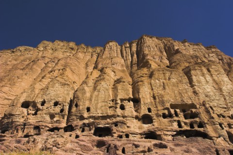 AFGHANISTAN, Bamiyan Province, Bamiyan , Caves in cliffs near empty niche where the famous carved