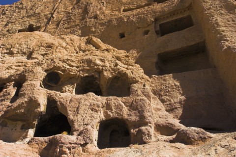 AFGHANISTAN, Bamiyan Province, Bamiyan , Caves in cliffs near empty niche where the famous carved