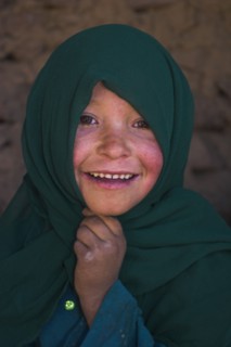 AFGHANISTAN, Bamiyan Province, Bamiyan , Girl that lives in a cave in the cliffs near empty niche