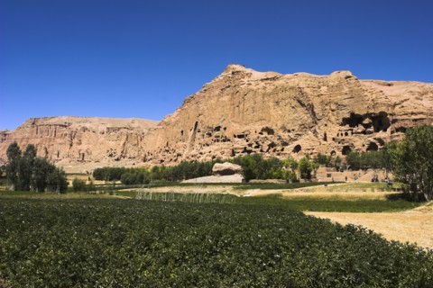 AFGHANISTAN, Bamiyan Province, Bamiyan , General view over crop field with mountains behind.