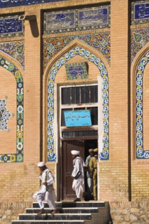 AFGHANISTAN, Herat, Men leaving Friday Mosque or Masjet-eJam Originally laid out on the site of an