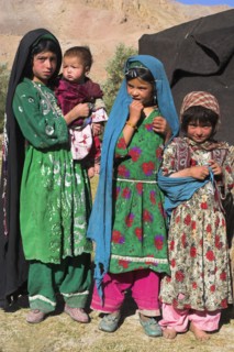 AFGHANISTAN, Ghor Province, Pal-Kotal-i-Guk, "Aimaq nomad camp, Aimaq girls and baby in front of