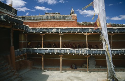 NEPAL, Mustang, Namgyal, Tibetan Buddhist monks awaiting the arrival of the King from upper balcony