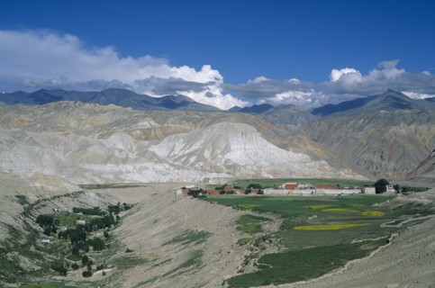 NEPAL, Mustang, Lo Manthang, "Distant view of Mustang’s capital Lo Manthang surrounded by green,