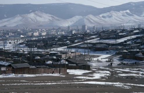 MONGOLIA, Ulan Bator, Traditional housing surrounding Soviet built city centre in winter snow with