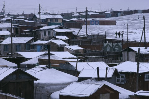 MONGOLIA, Ulan Bator, Snow covered rooftops of traditional housing in city suburb in winter.