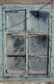 MONGOLIA, Architecture, Detail of window with pale blue painted frame and frost patterns decorating