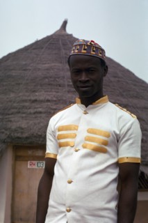 NIGERIA, People, Three-quarter portrait of young man working for hotel.