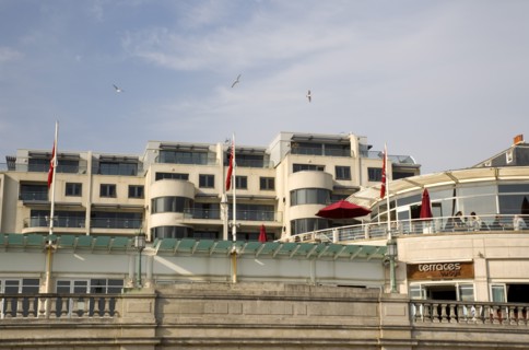 ENGLAND, East Sussex, Brighton, Modern seafront aprtments and restaurants on Marine Parade.