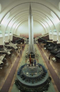 CHINA, Beijing, "Interior hall of the Chinese Military Museum with visitors looking at display of