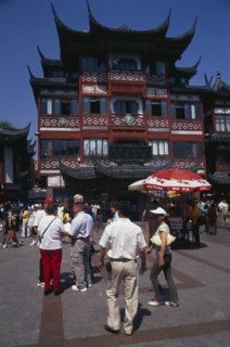 CHINA, Shanghai, "Yu Gardens street scene with shoppers, tourists, shops and souvenir stalls."