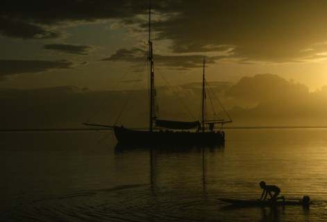 PACIFIC ISLANDS, French Polynesia, Tahiti, Sunset reflected in still expanse of water with