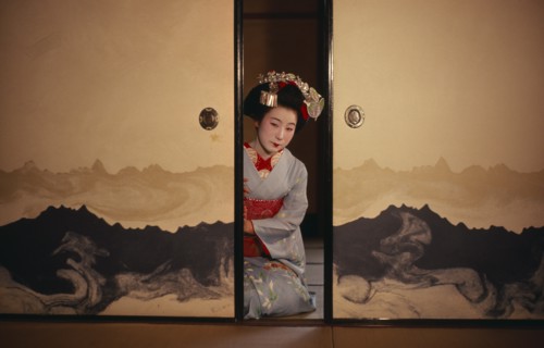 JAPAN, Customs, Geisha, "Portrait of Someiyu, a maiko or trainee geisha kneeling in tightly bound