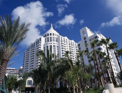 USA, Florida, Miami, South Beach. Loews Hotel exterior with palm trees and blue sky