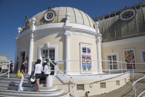 ENGLAND, West Sussex, Worthing, The Pavilion Theatre exterior with a group of girls on the steps