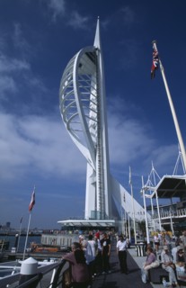 ENGLAND, Hampshire, Portsmouth, Gunwharf Keys. The Spinnaker Tower with people on the waterfront