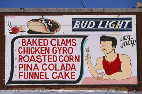 USA, New York, New York City, Coney Island.  Sign for cafe / bar listing food and drink  with