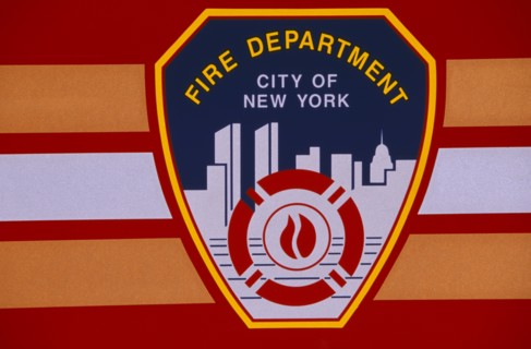 USA, New York, New York City, Detail of New York fire department badge on side of fire engine or