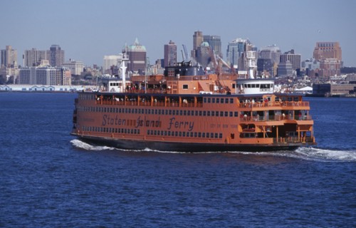 USA, New York, New York City, Staten Island ferry with city skyline beyond.