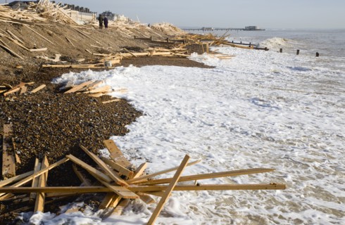 ENGLAND, West Sussex, Worthing, Timber washed up on the beach from the Greek registered Ice