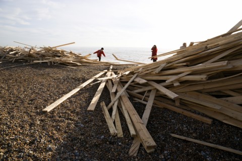ENGLAND, West Sussex, Worthing, Timber washed up on the beach from the Greek registered Ice