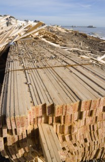 ENGLAND, West Sussex, Worthing, Timber washed up on the beach from the Greek registered Ice