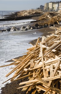 ENGLAND, West Sussex, Worthing, Timber washed up on the beach from the Greek registered Ice