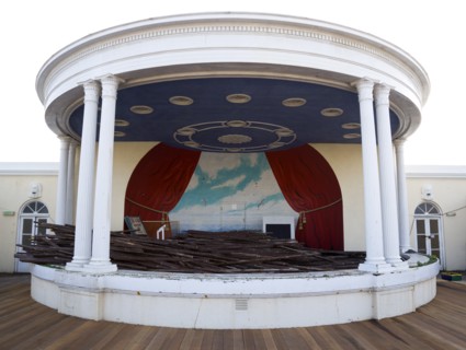 ENGLAND, West Sussex, Worthing, Piles of old decking in the bandstand on the day that timber was