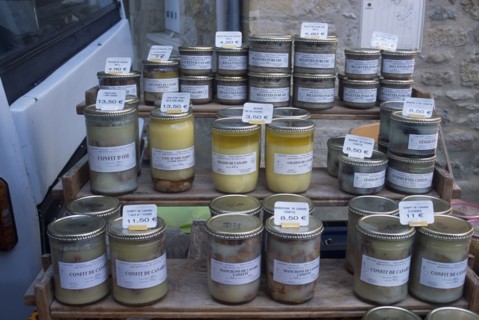 FRANCE, Midi Pyrenees, Pryassac, Jars of Pate and Foie Gras on sale in the market.