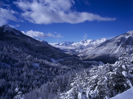 FRANCE, Provence-Cote d’Azur, Hautes-Alpes, View west from Col de Montgenevre over snow covered