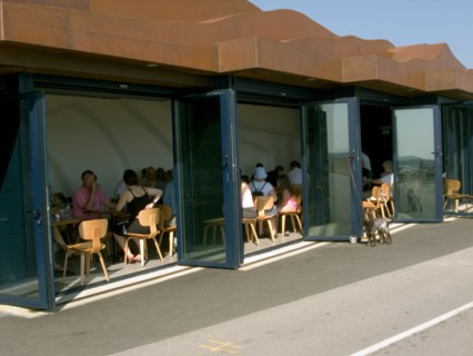 ENGLAND, West Sussex, Littlehampton, Customers sitting at tables inside the East Beach Cafe