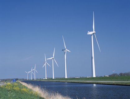 HOLLAND, Noord Holland, Alkmaar, Row of Wind turbines along the Noord Hollands Kanaal north of