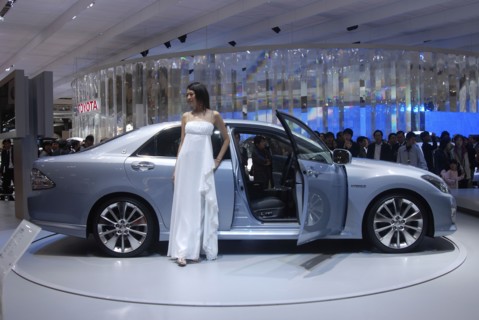 JAPAN, Honshu, Chiba, "Tokyo Car Show, crowd watching new Toyota Lexus Hybrid"