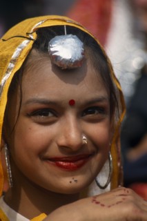 INDIA, Punjab, Kila Raipur, Portrait of a young girl dancer smiling at the Rural Sports Festival
