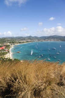 WEST INDIES, St Lucia, Gros Islet , Beach lined Rodney Bay with yachts at anchor seen from Signal