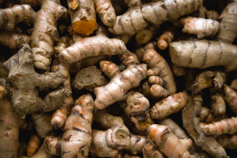 WEST INDIES, St Lucia, Castries, Market spice stall with galangal a member of the ginger family