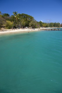 WEST INDIES, St Lucia, Gros Islet , Pigeon Island National Historic Park Tourists on the beach
