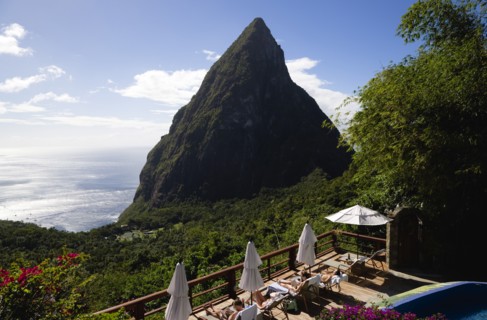 WEST INDIES, St Lucia, Soufriere , Val des Pitons Tourists sunbathing on the sun deck beside the