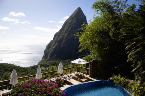 WEST INDIES, St Lucia, Soufriere , Val des Pitons Tourists sunbathing on the sun deck beside the