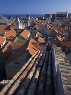 CROATIA, Dalmatia, Dubrovnik, "Elevated view over terracotta roof tops towards the Cathedral, St