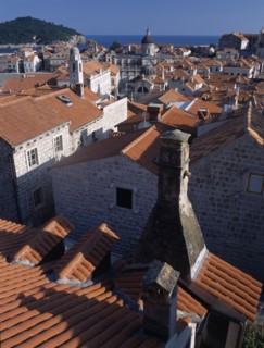CROATIA, Dalmatia, Dubrovnik, "Elevated view over terracotta roof tops towards the Cathedral, St