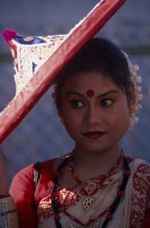 INDIA, Rajasthan, Jaipur, Portrait of female dancer with conical hat at the Jaipur Heritage