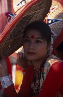 INDIA, Rajasthan, Jaipur, Portrait of a female dancer with conical hat at the Jaipur Heritage
