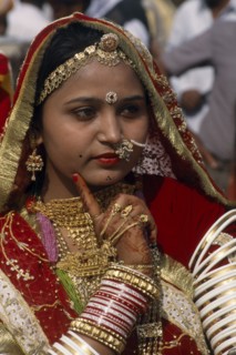INDIA, Rajasthan, Jaisalmer, "Portrait of a Miss Desert contestant with henna painted hands, finger