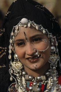 INDIA, Rajasthan, Jaisalmer, Head and shoulders portrait of a Miss Desert contestant  wearing