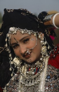 INDIA, Rajasthan, Jaisalmer, Head and shoulders portrait of a Miss Desert contestant  wearing