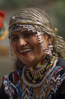 INDIA, Rajasthan, Alwar, Portrait of a Kalbelia dancer women smiling at the Alwar Utsav Festival