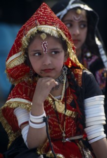 INDIA, Rajasthan, Alwar, Young girl dancer wearing traditional jewellery at the Alwar Utsav