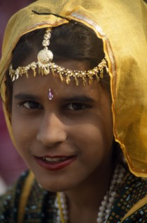 INDIA, Rajasthan, Alwar, Head and shoulders portrait of a young girl at the Alwar Utsav Festival